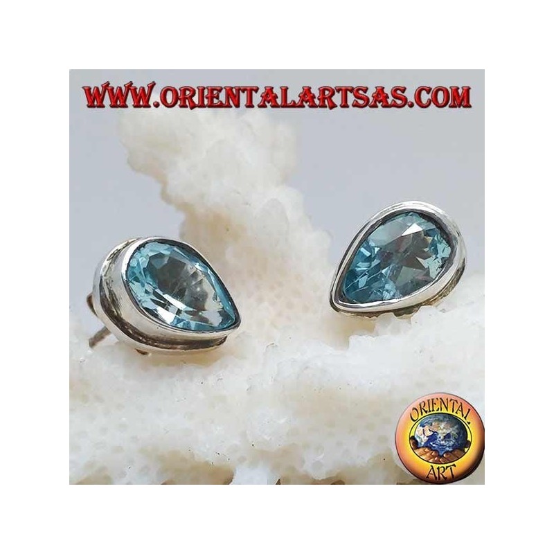 Silver lobe earrings with blue drop topaz on a simple silver setting
