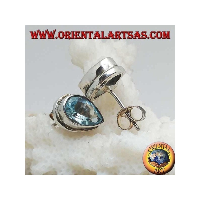 Silver lobe earrings with blue drop topaz on a simple silver setting