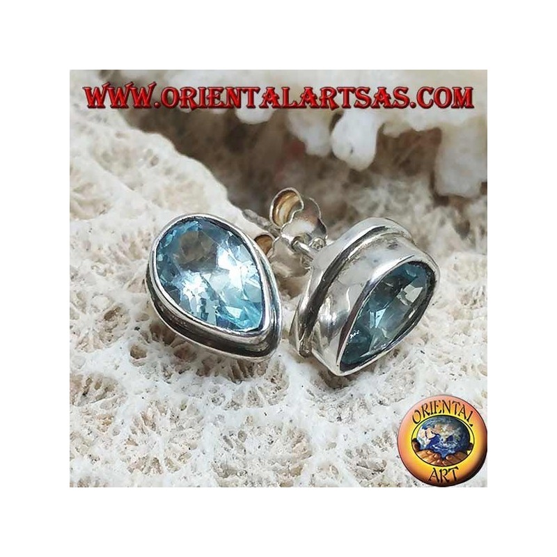 Silver lobe earrings with blue drop topaz on a simple silver setting