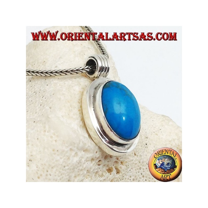 Silver pendant with oval turquoise cabochon on a thick smooth frame and a striped hook