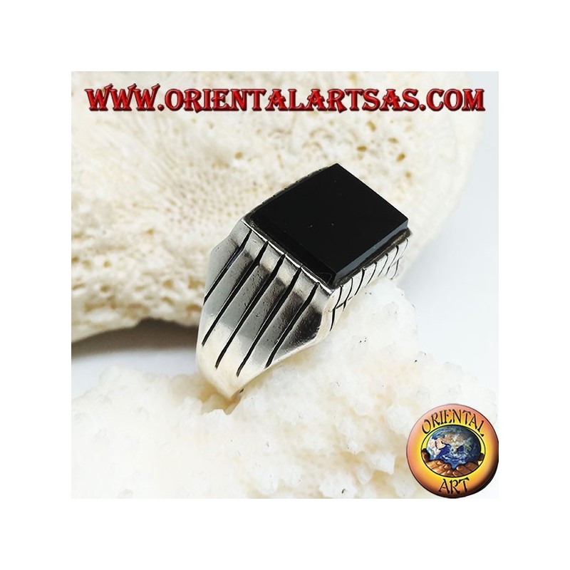 Silver ring with raised rectangular flat onyx and stripes on the sides