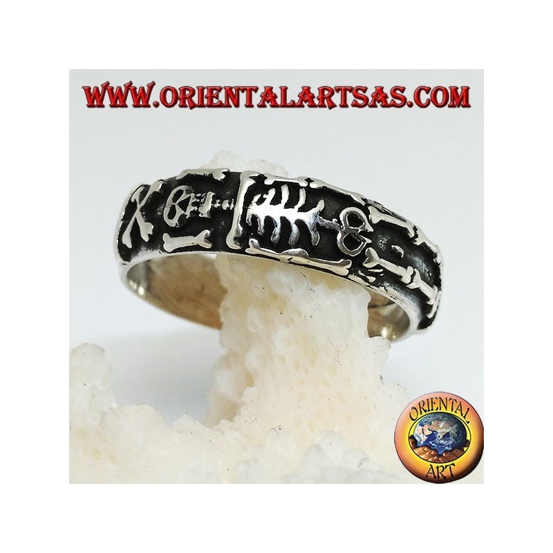 Silver record ring with integral high relief skeleton