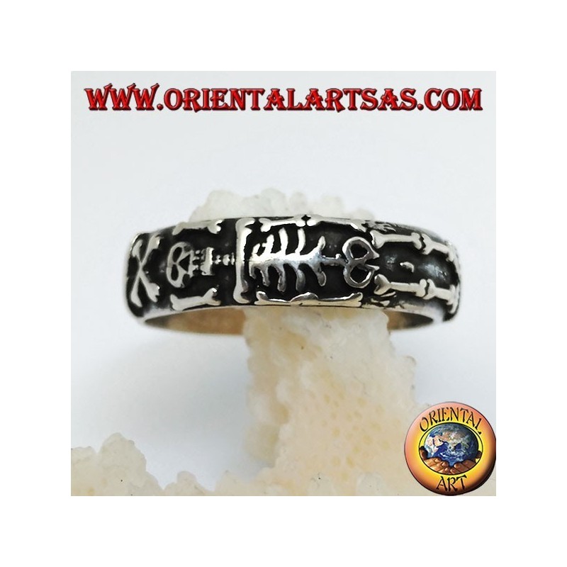 Silver record ring with integral high relief skeleton