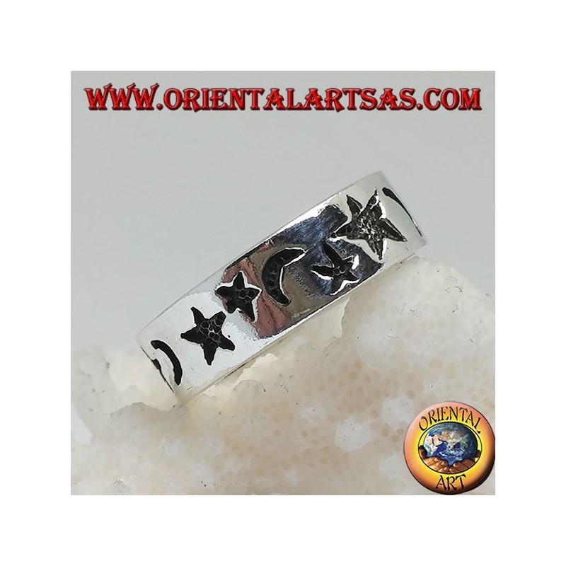 Smooth silver ring with thick engravings of stars and moons