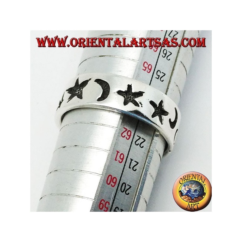 Smooth silver ring with thick engravings of stars and moons
