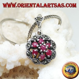 Silver pendant with triple concentric circles of natural round rubies set and shuttle marcasite