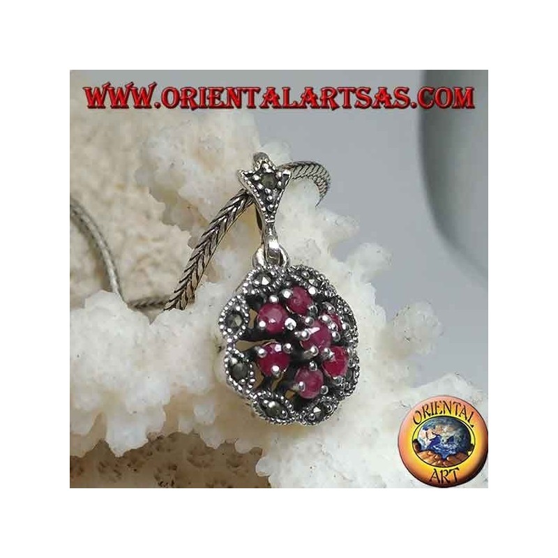 Silver pendant with triple concentric circles of natural round rubies set and shuttle marcasite