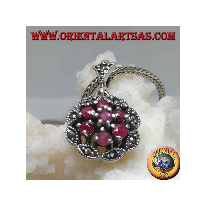 Silver pendant with triple concentric circles of natural round rubies set and shuttle marcasite