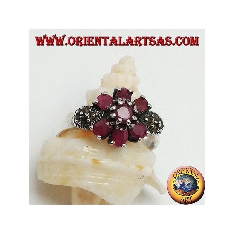 Silver ring with natural round ruby set with three rubies above and below and marcasite on the sides