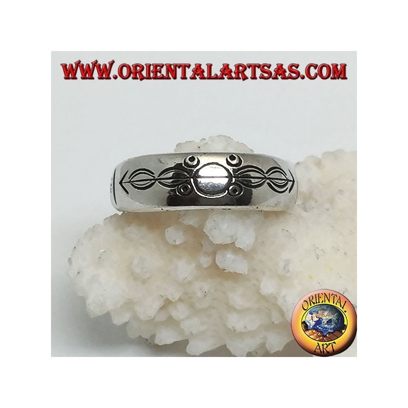 Silver ring with ring engraved circles and ovals impaled by an arrow