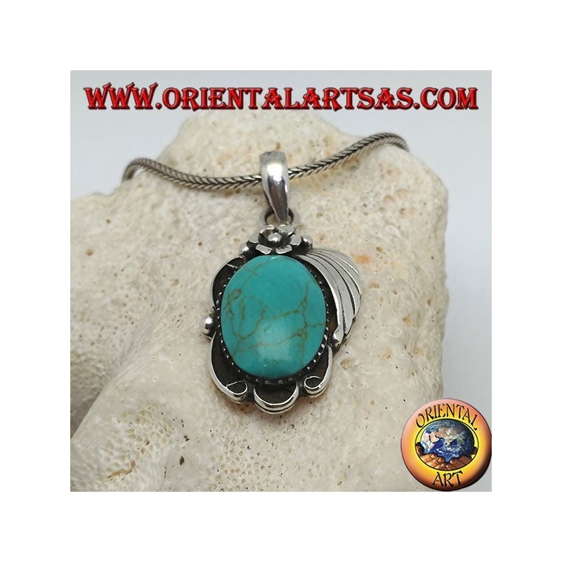Colgante de plata con turquesa ovalada grande en un marco con flor y cinta