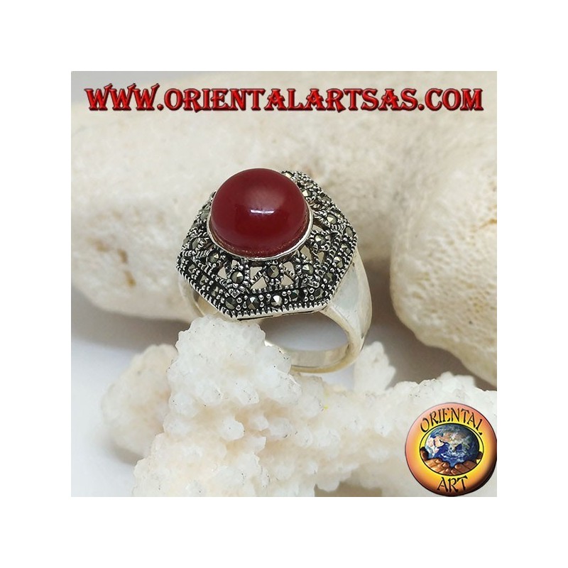 Silver ring with round cabochon carnelian on a decorated perforated hexagon studded with marcasite