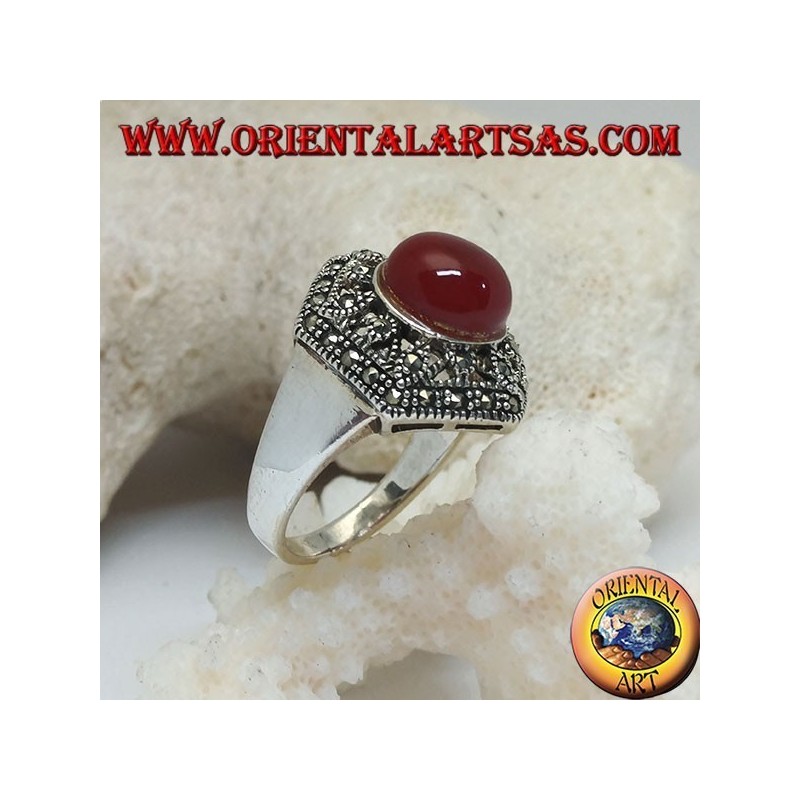 Silver ring with round cabochon carnelian on a decorated perforated hexagon studded with marcasite
