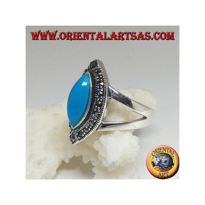 Silver ring, with turquoise cabochon cut shuttle surrounded by marcasite