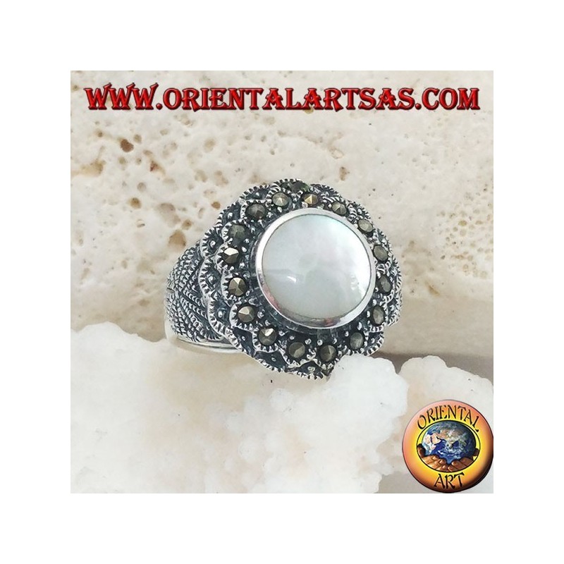Silver ring with raised mother of pearl surrounded by marcasite