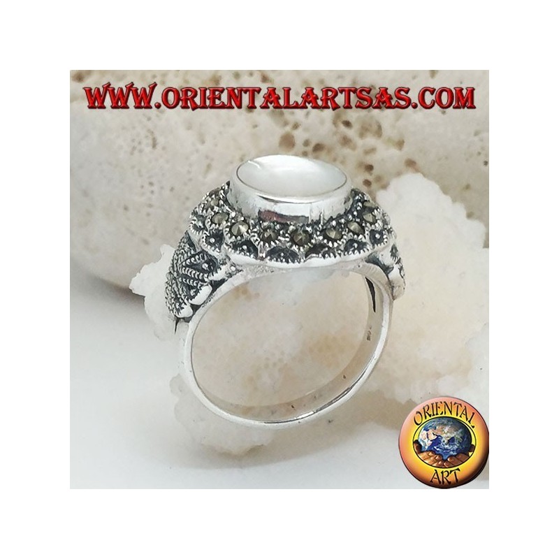 Silver ring with raised mother of pearl surrounded by marcasite