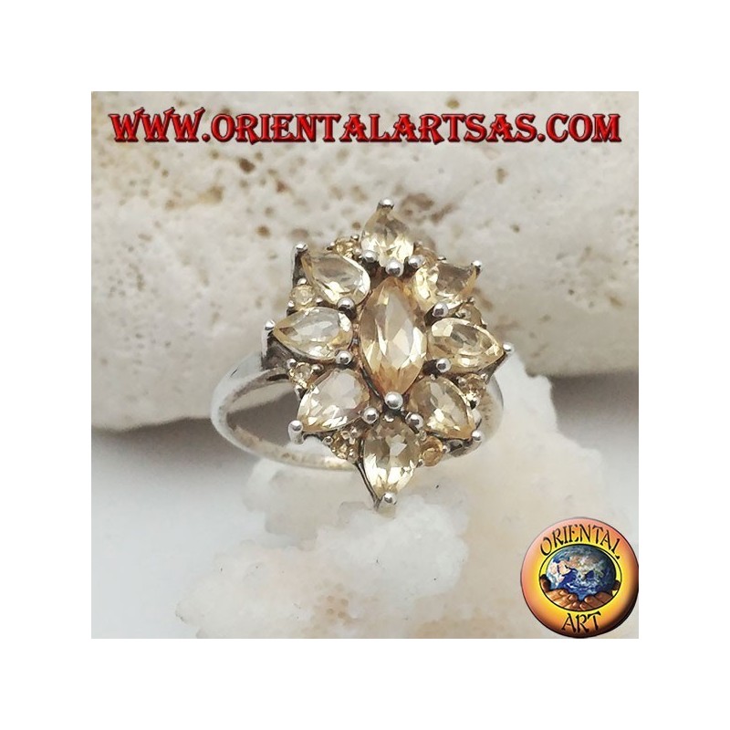 Silver oval flower ring formed by embedded shuttle citrine topazes