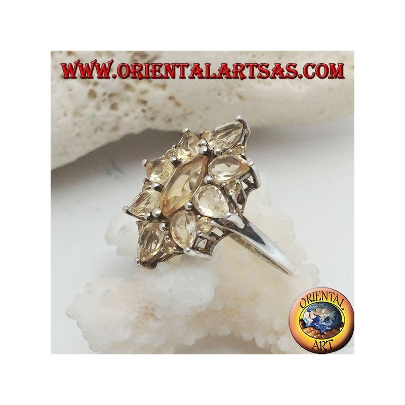 Silver oval flower ring formed by embedded shuttle citrine topazes