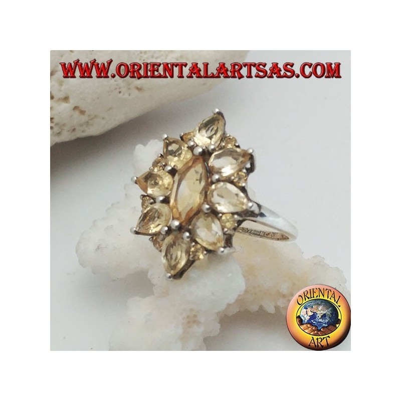 Silver oval flower ring formed by embedded shuttle citrine topazes