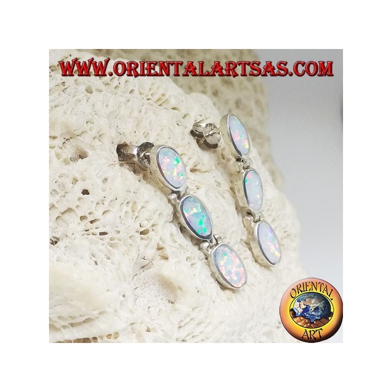 Silver lobe earrings with a row of three hanging oval white opals