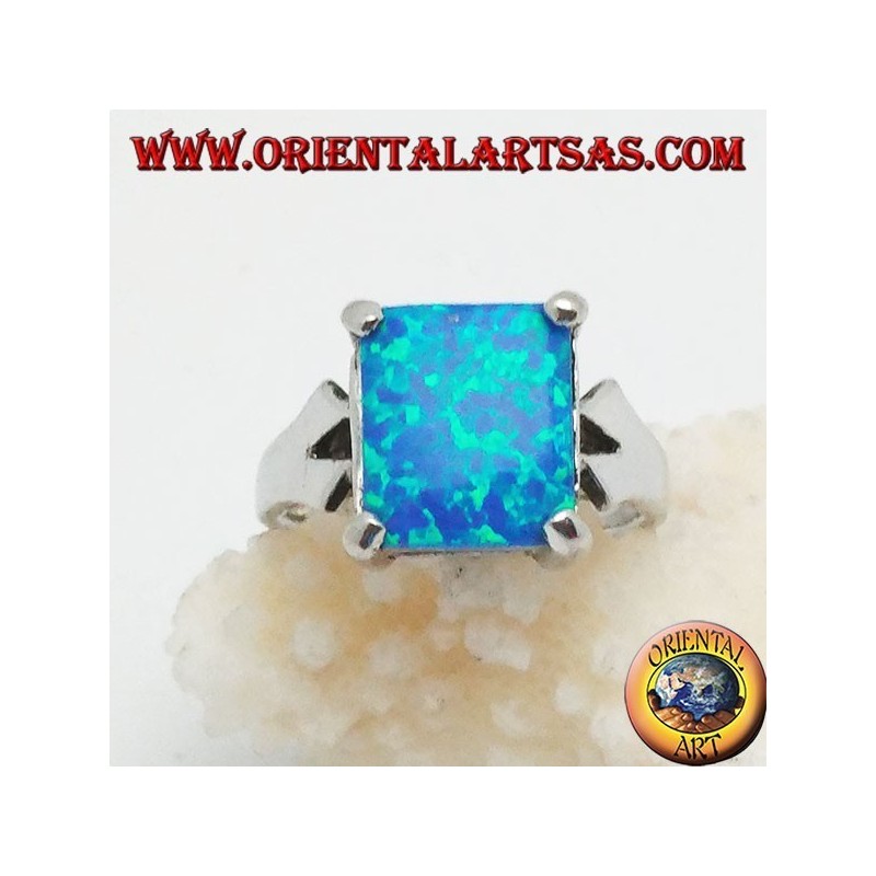 Silver ring with embedded rectangular blue fire opal and V-frame on the sides