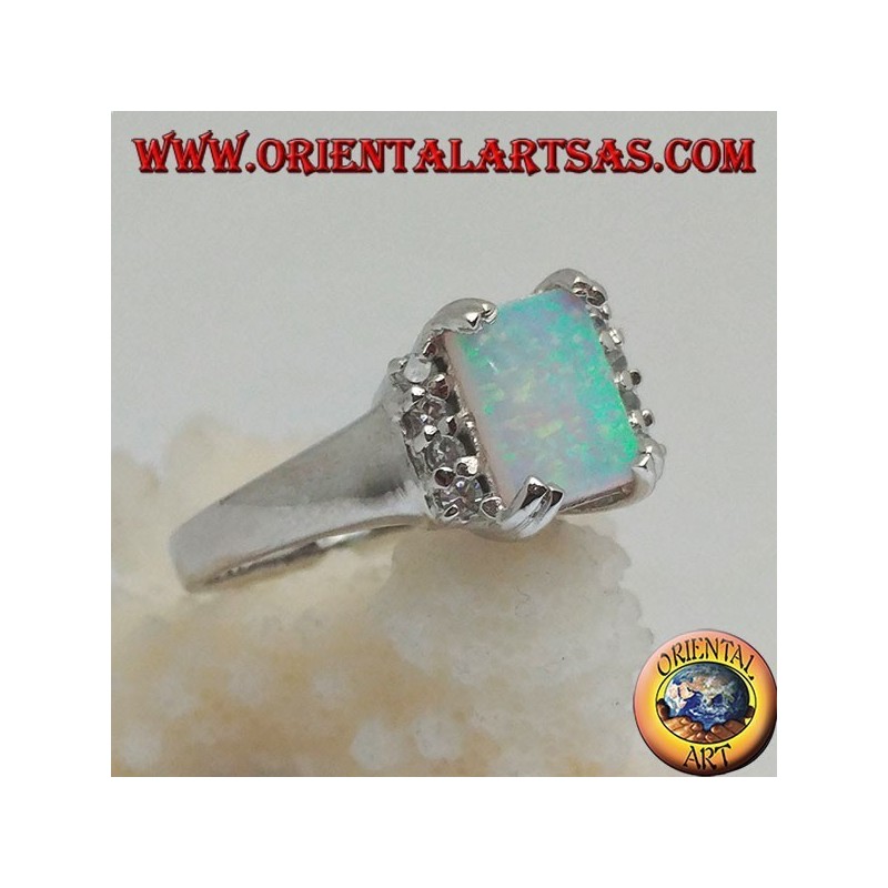 Silver ring with rectangular harlequin opal set in four and row of zircons on the sides