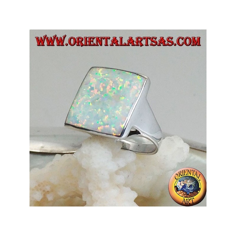 Silver ring with large square harlequin opal with openwork on the corners