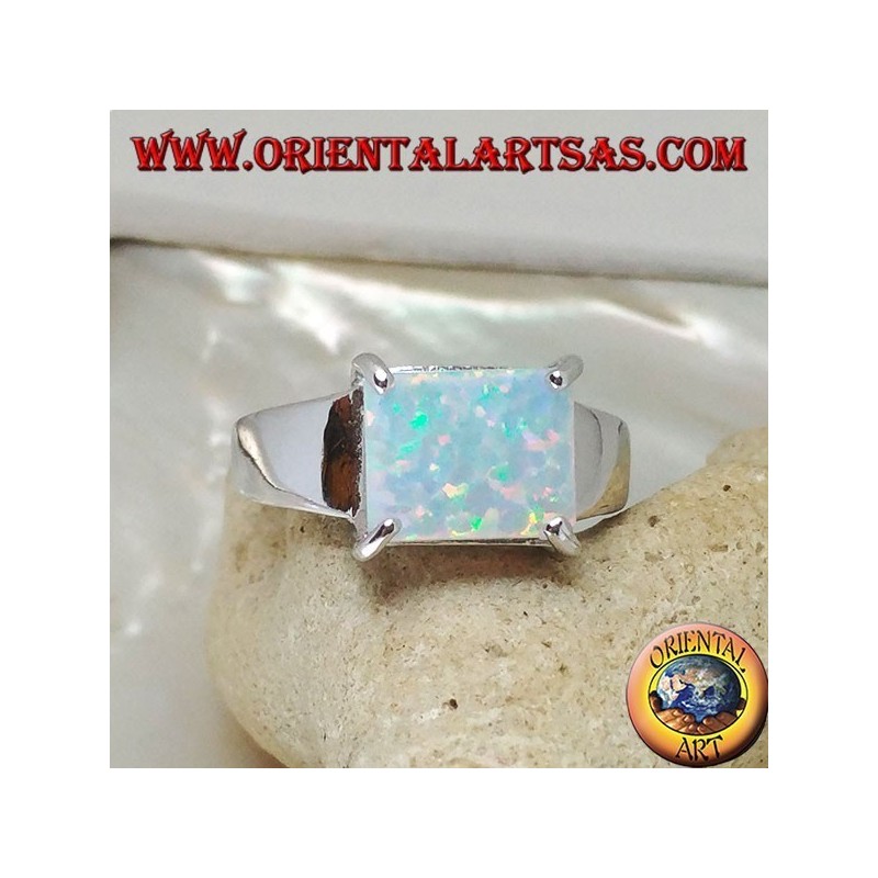 Silver ring with horizontal rectangular harlequin opal set in four