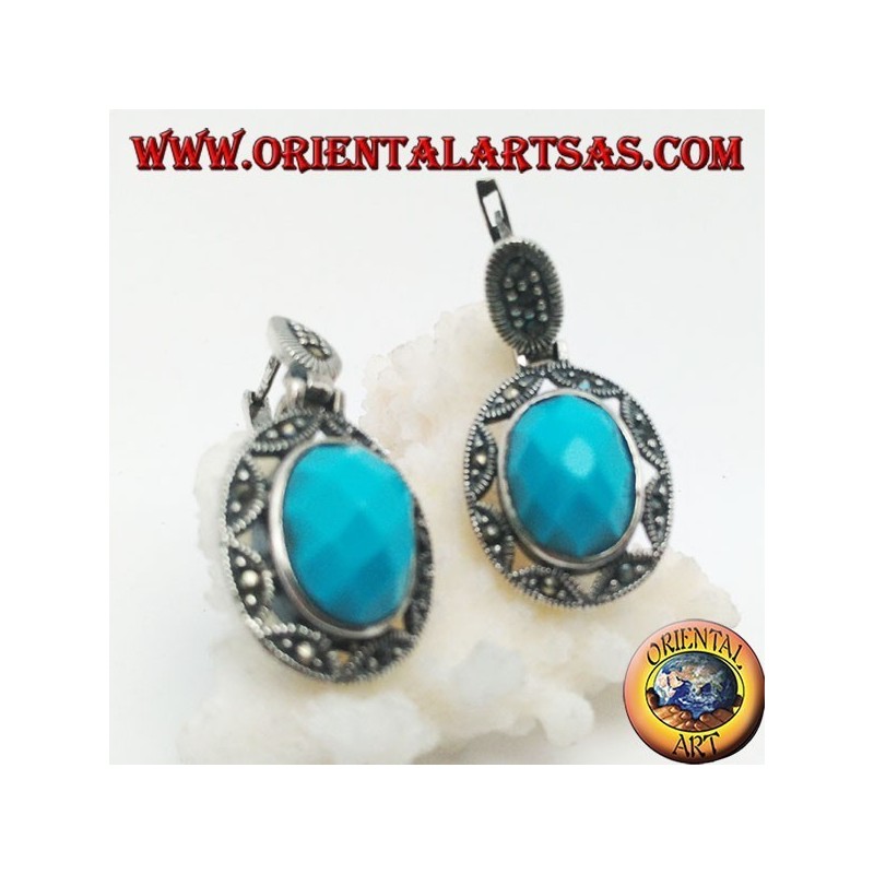 Orecchini in argento con turchese ovale sfaccettato cabochon contornato da traforo a stella e marcassite