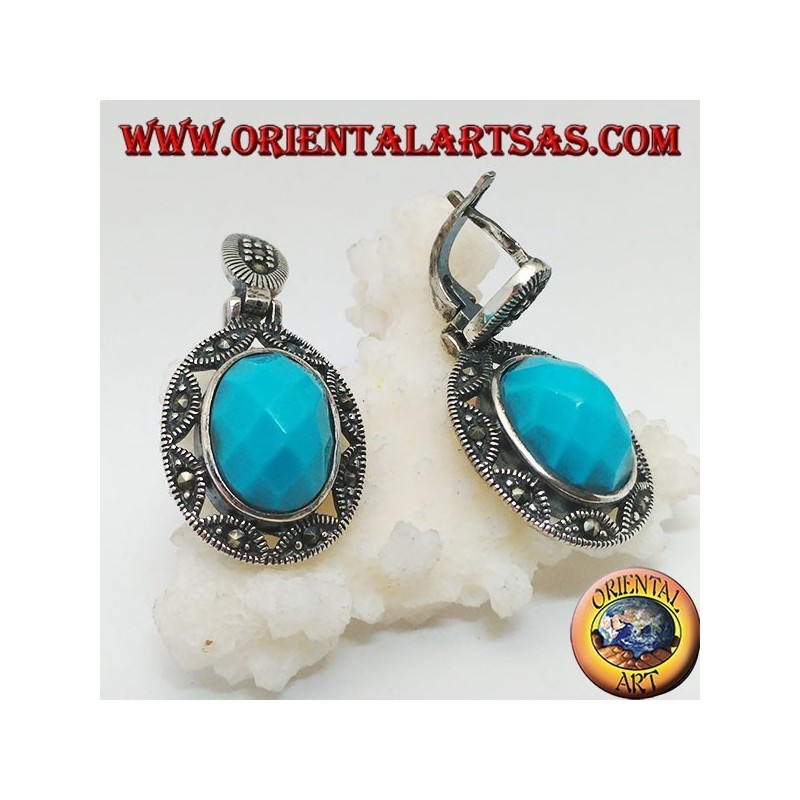 Boucles d'oreilles en argent avec cabochon ovale à facettes turquoise entourées d'une broderie d'étoiles et de marcassite