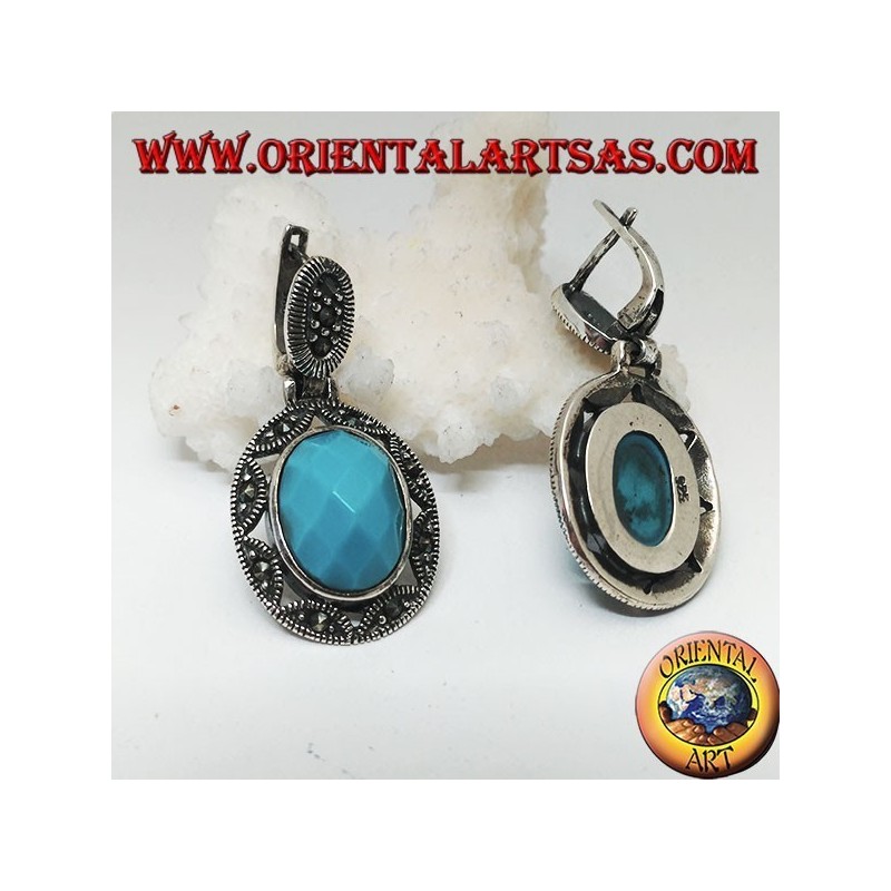 Orecchini in argento con turchese ovale sfaccettato cabochon contornato da traforo a stella e marcassite