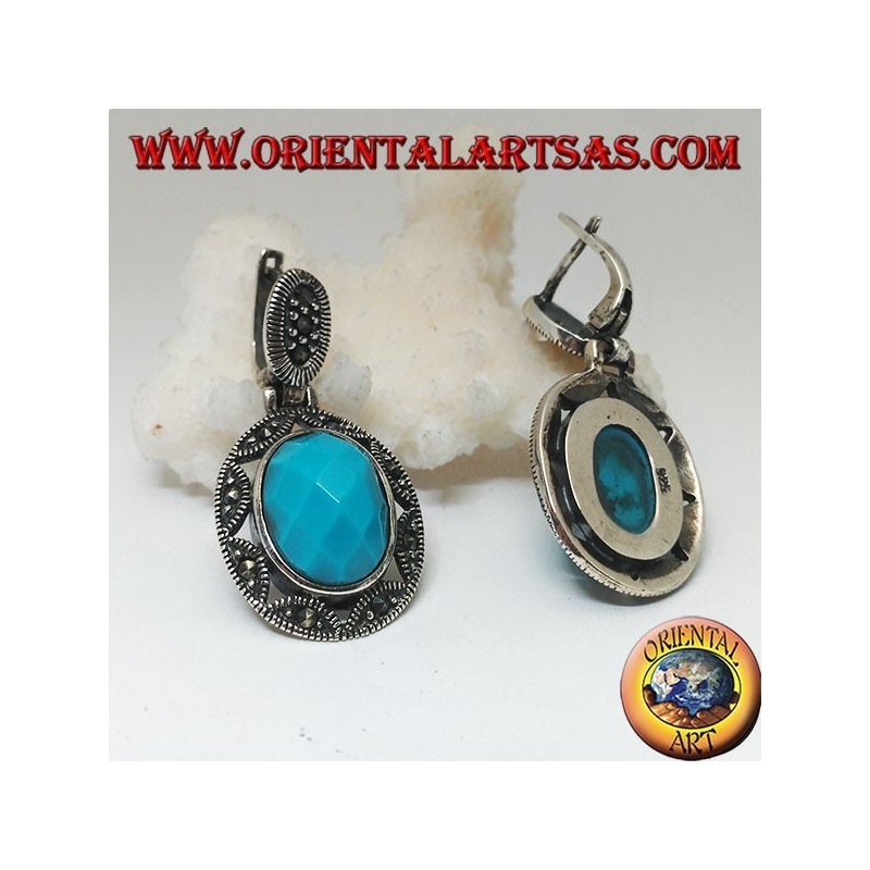 Orecchini in argento con turchese ovale sfaccettato cabochon contornato da traforo a stella e marcassite
