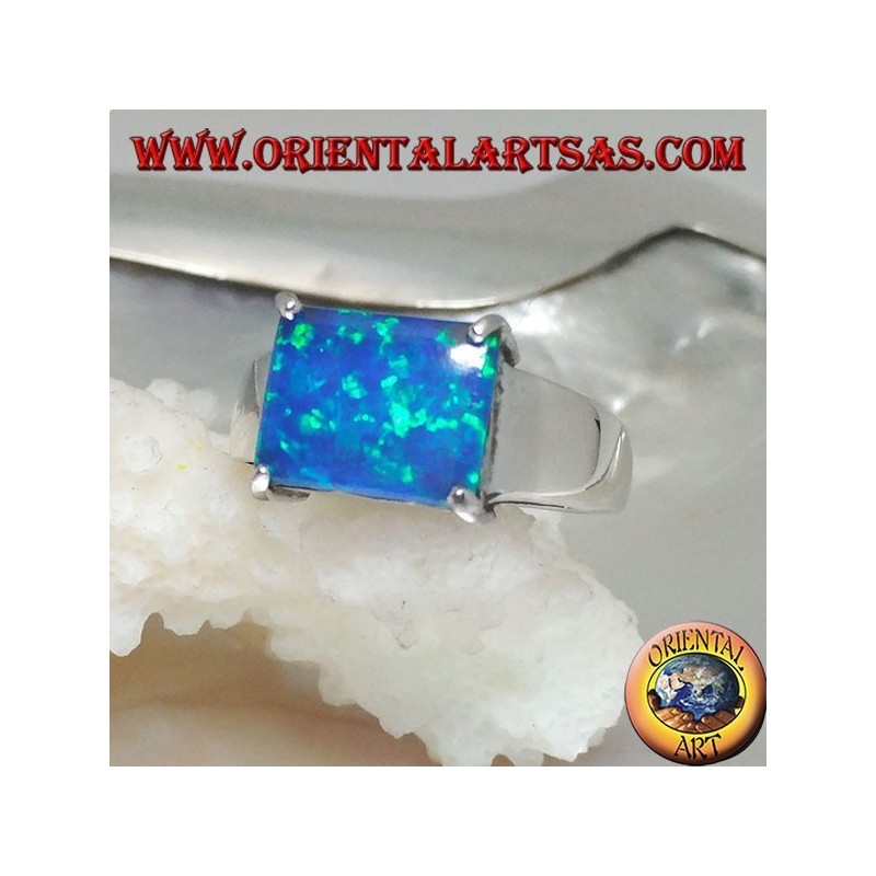 Silver ring with horizontal rectangular blue opal set in four