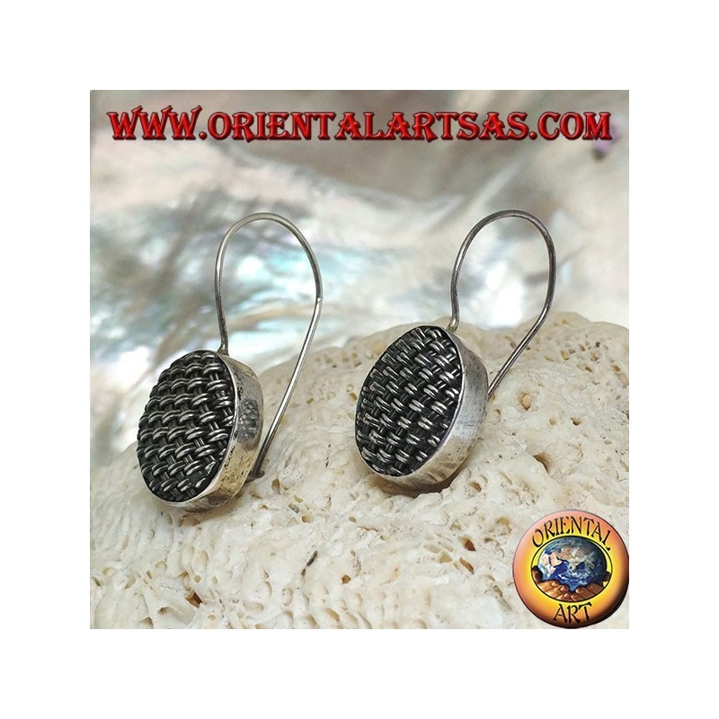Dangling silver earrings with tightly woven oval