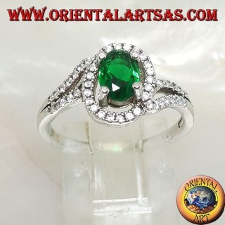 Silver ring with oval synthetic emerald set surrounded by zircons on a concentric setting