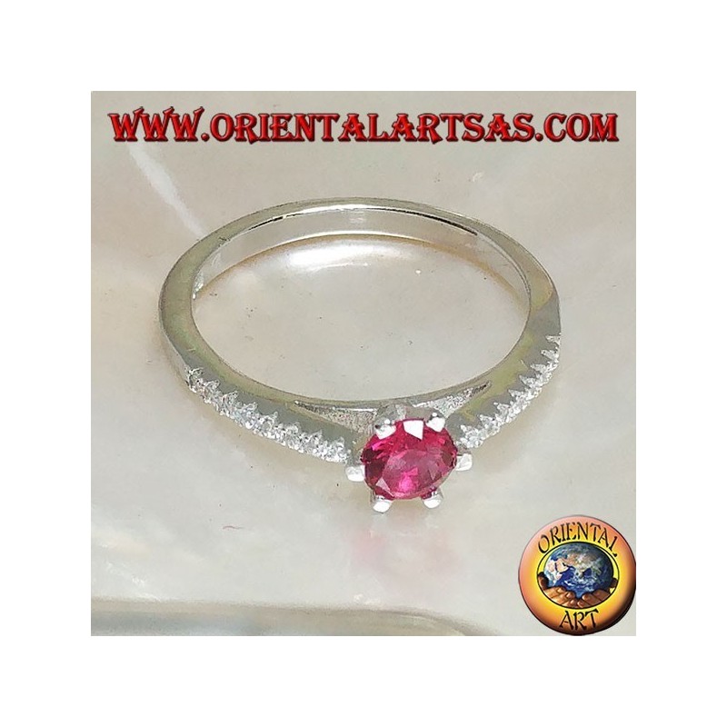 Silver ring with round synthetic ruby set on a thin row of cubic zirconia setting