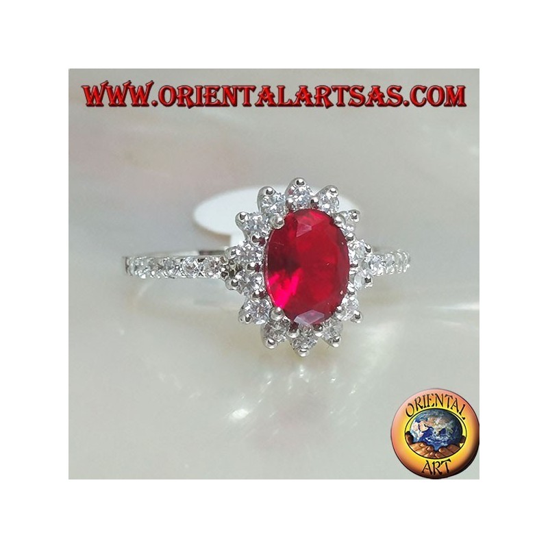 Anello in argento con granato ovale incastonato contornato da zirconi e fila sui lati