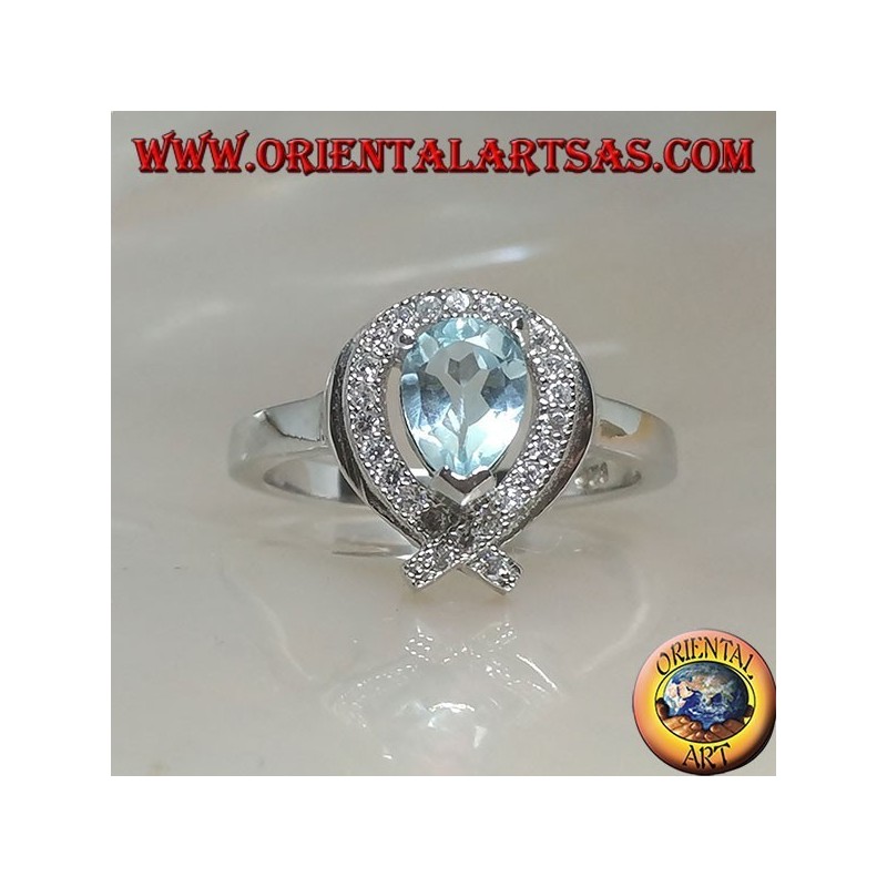 Bague en argent avec topaze goutte bleue naturelle entourée de zircons (intersection sur la pointe)