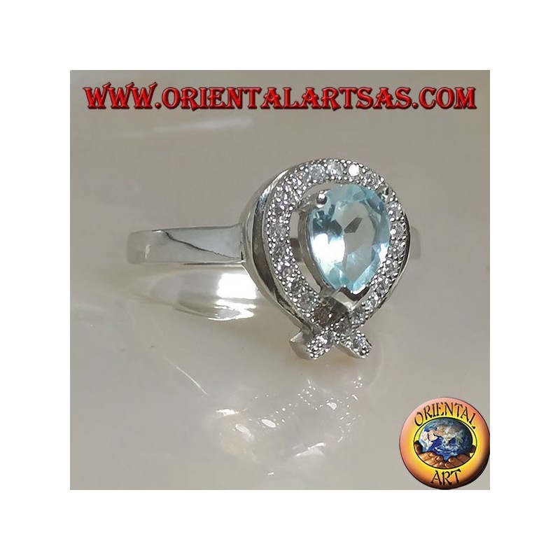 Silver ring with natural blue drop topaz surrounded by zircons (intersection on tip)