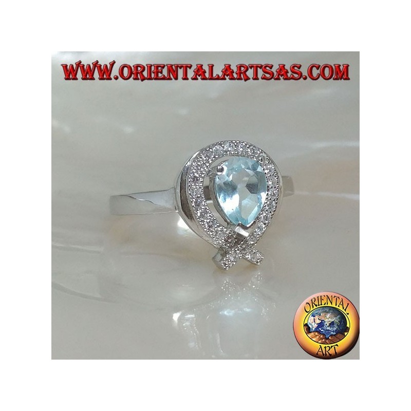 Anillo de plata con topacio azul natural rodeado de circonitas (intersección en la punta)