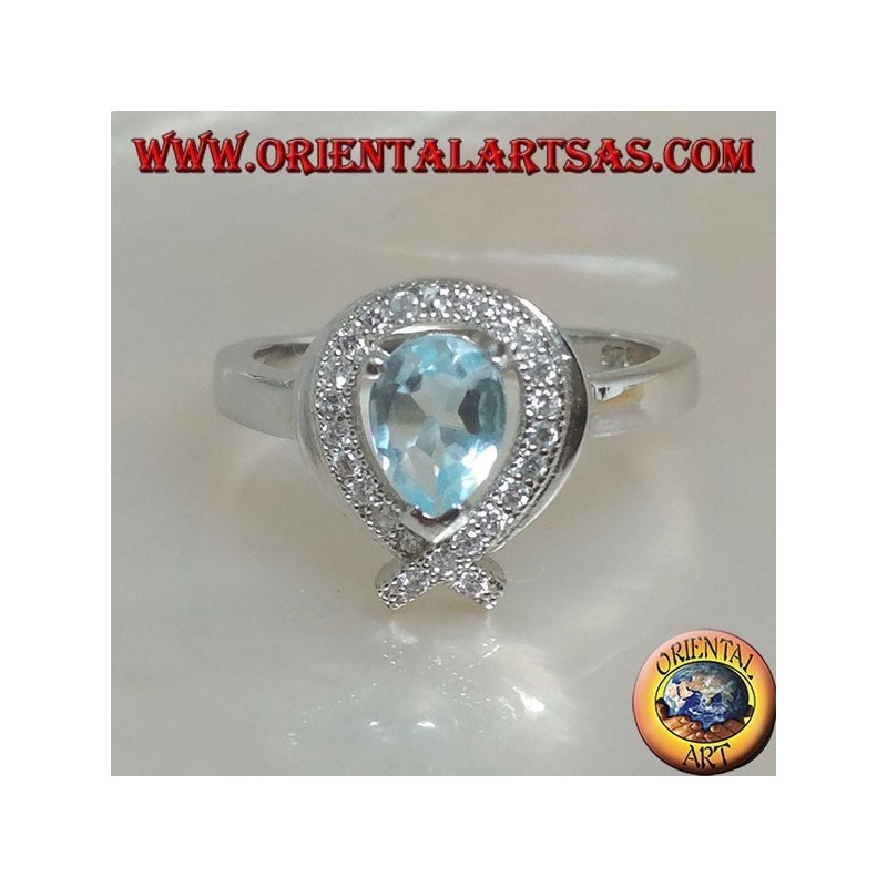 Anillo de plata con topacio azul natural rodeado de circonitas (intersección en la punta)