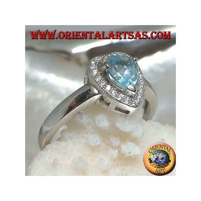 Silver ring with natural blue drop topaz set surrounded by zircons