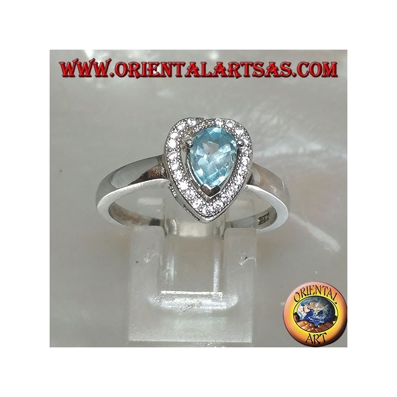 Anillo de plata con topacio azul natural engastado rodeado de circonitas