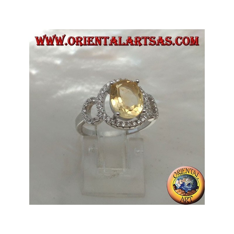Bague en argent avec topaze jaune naturelle ovale sertie sur un sertissage zircone à trois cercles