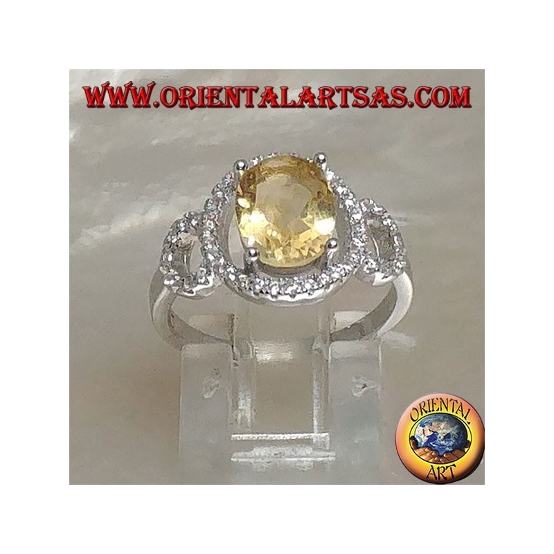 Bague en argent avec topaze jaune naturelle ovale sertie sur un sertissage zircone à trois cercles