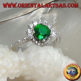 Silver ring with round synthetic emerald set surrounded by small and large zircons