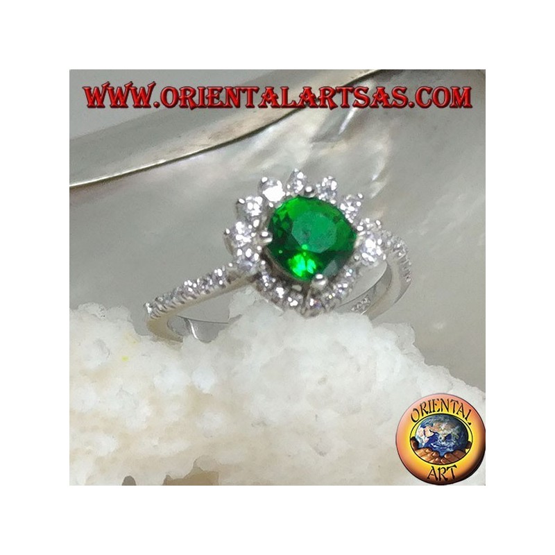 Silver ring with round synthetic emerald set surrounded by small and large zircons