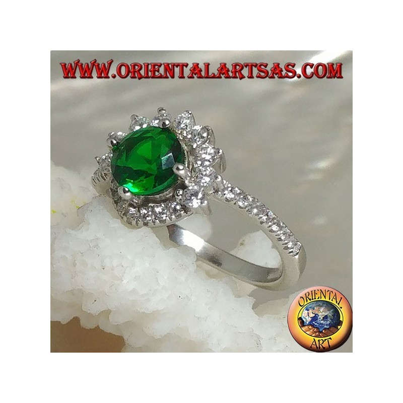Silver ring with round synthetic emerald set surrounded by small and large zircons