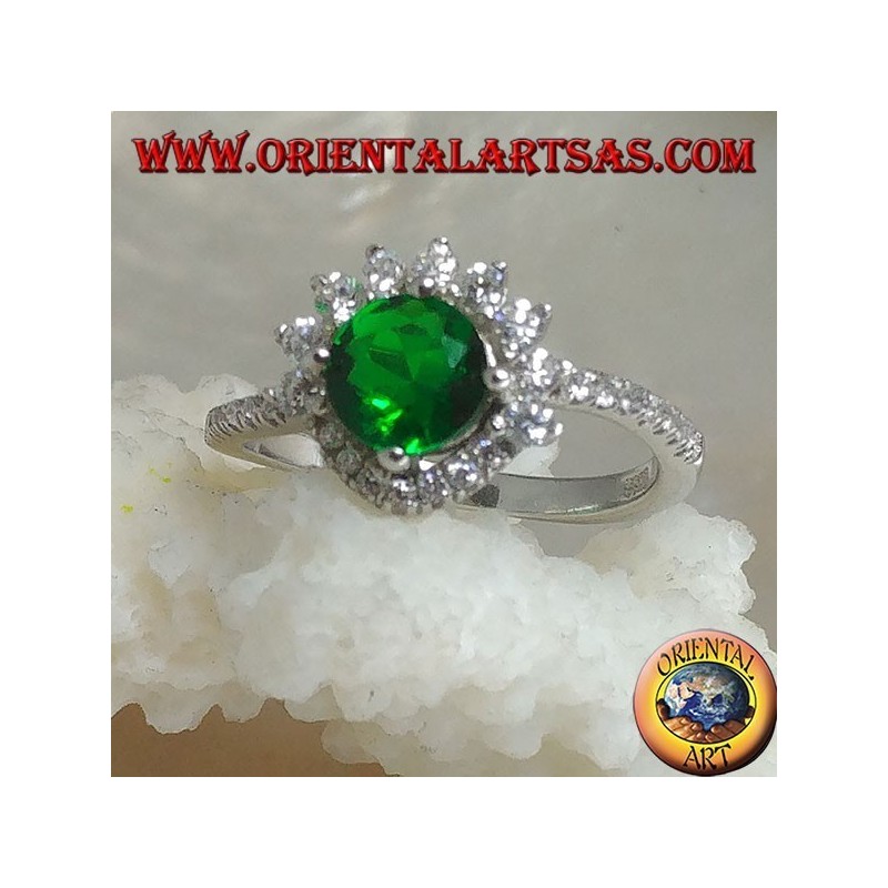 Silver ring with round synthetic emerald set surrounded by small and large zircons