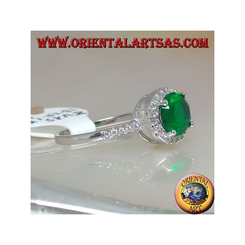 Silver ring with round synthetic emerald set surrounded by zircons